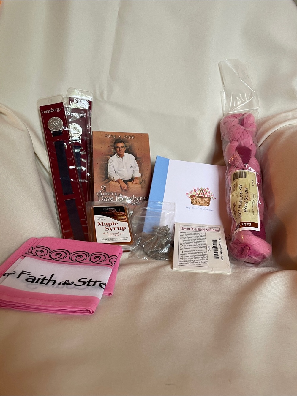 Longaberger items including Magnets, notebook, scarf, bookmarks, VHS tape, plus